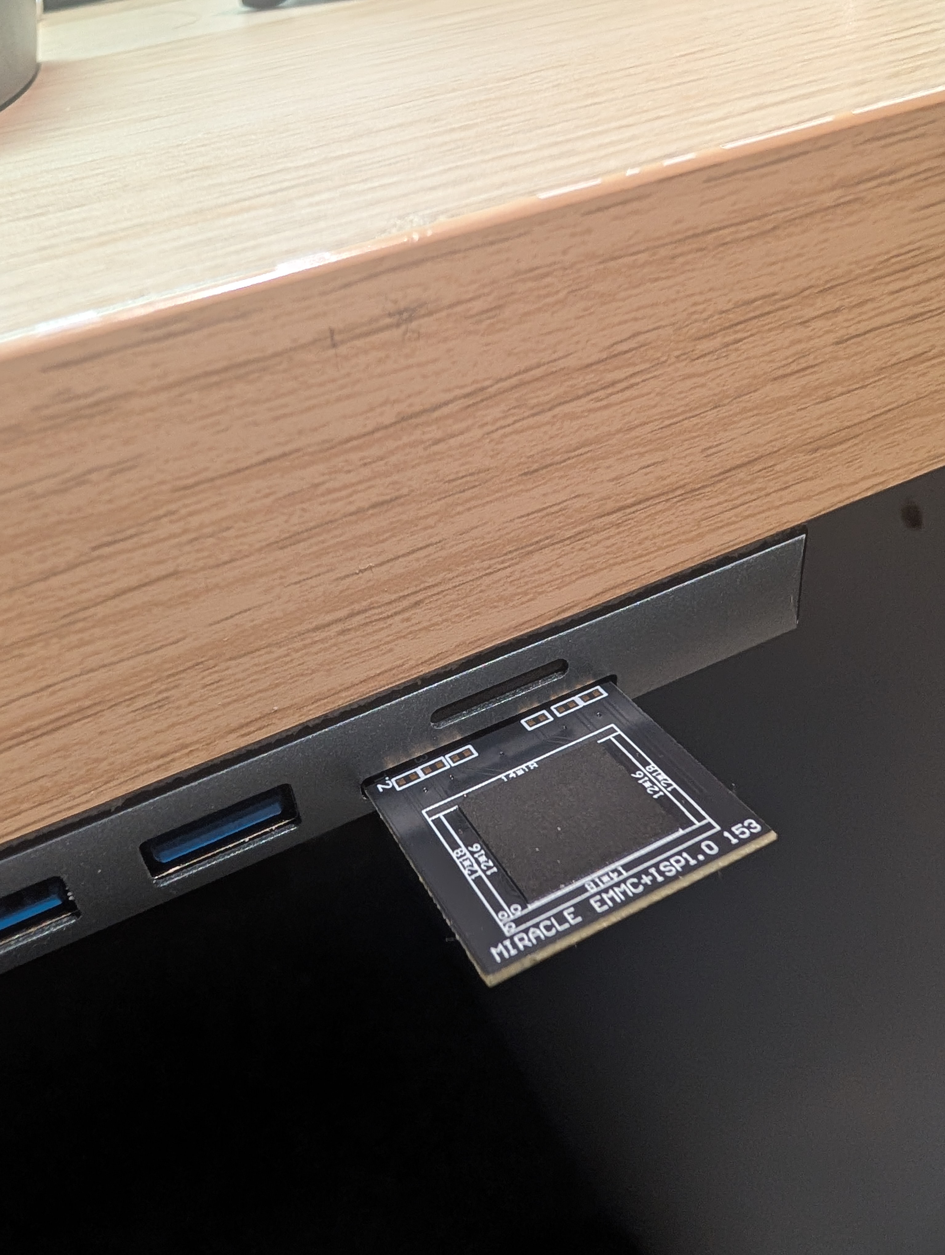 MIRACLE EMMC adapter inserted into laptop SD card reader